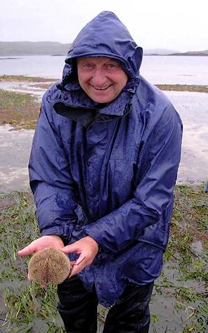 Skye-mammal-man-Roger-Cottis-holding-sea-urchin-Spatangus-purpureus